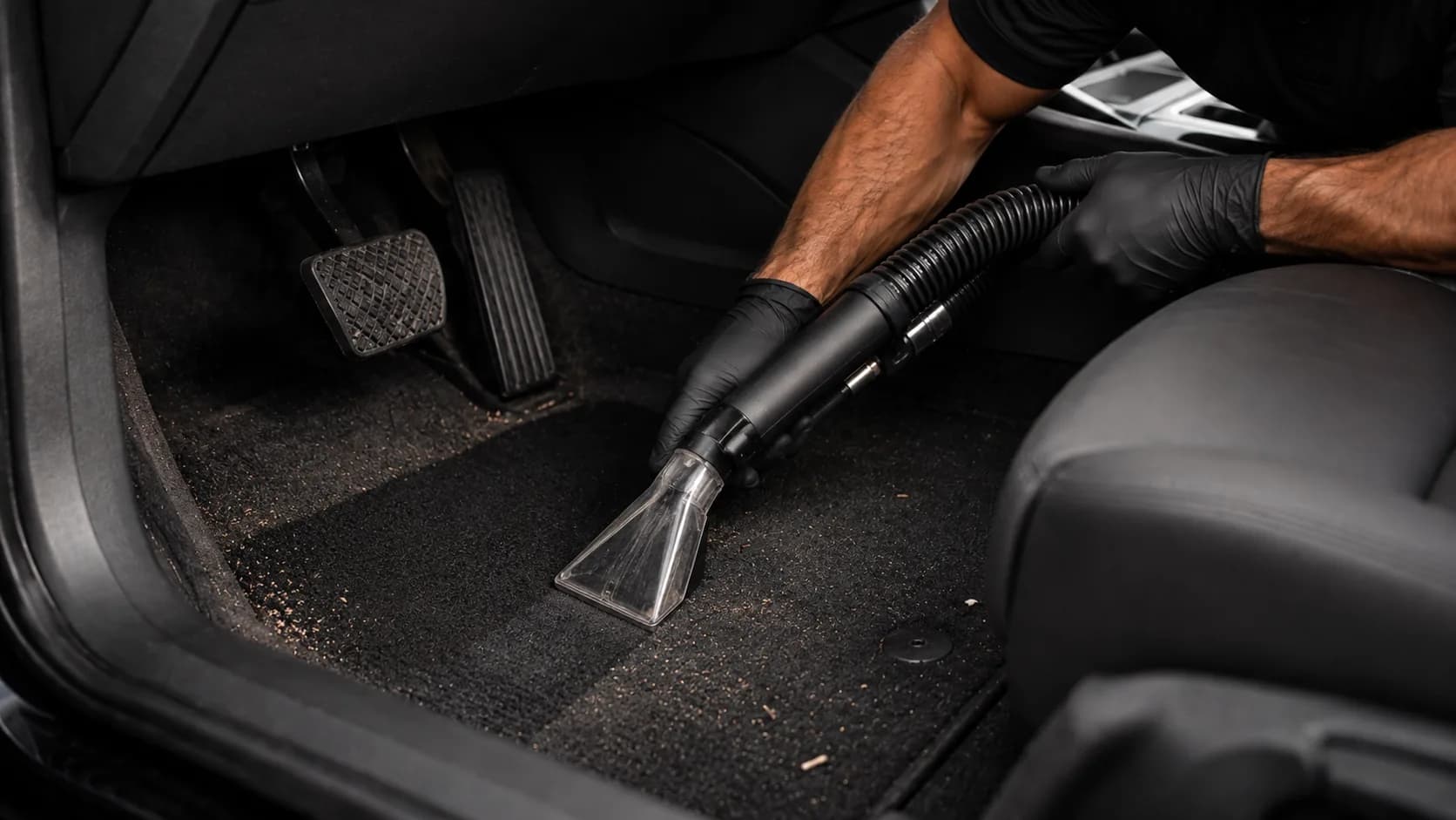 A car interior being cleaned